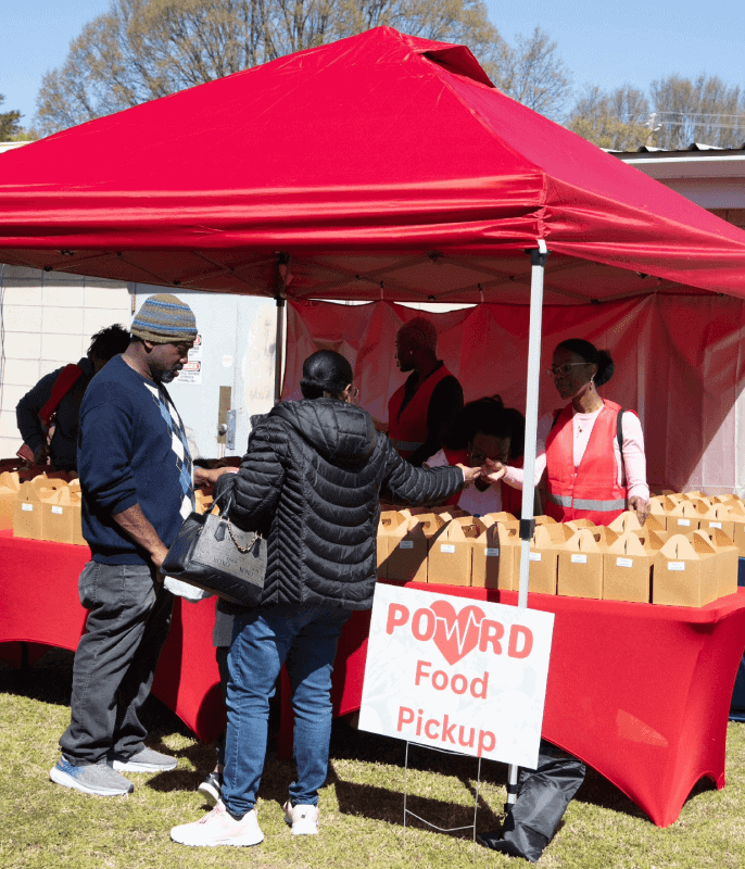 Community food pickup event organized by Angela J. White Consulting.