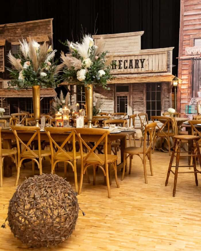 Beautiful event setup with floral centerpieces and rustic decor.