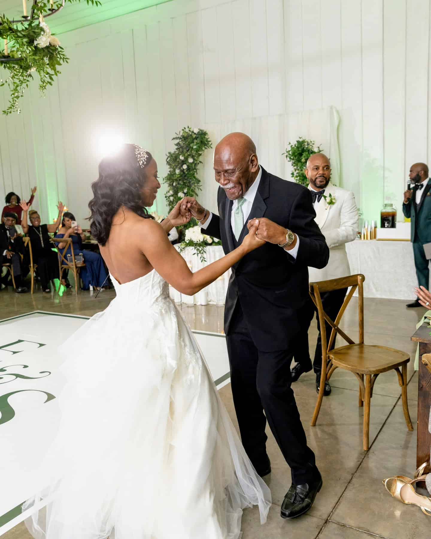 Dancing couple at wedding reception for Angela J. White Consulting.