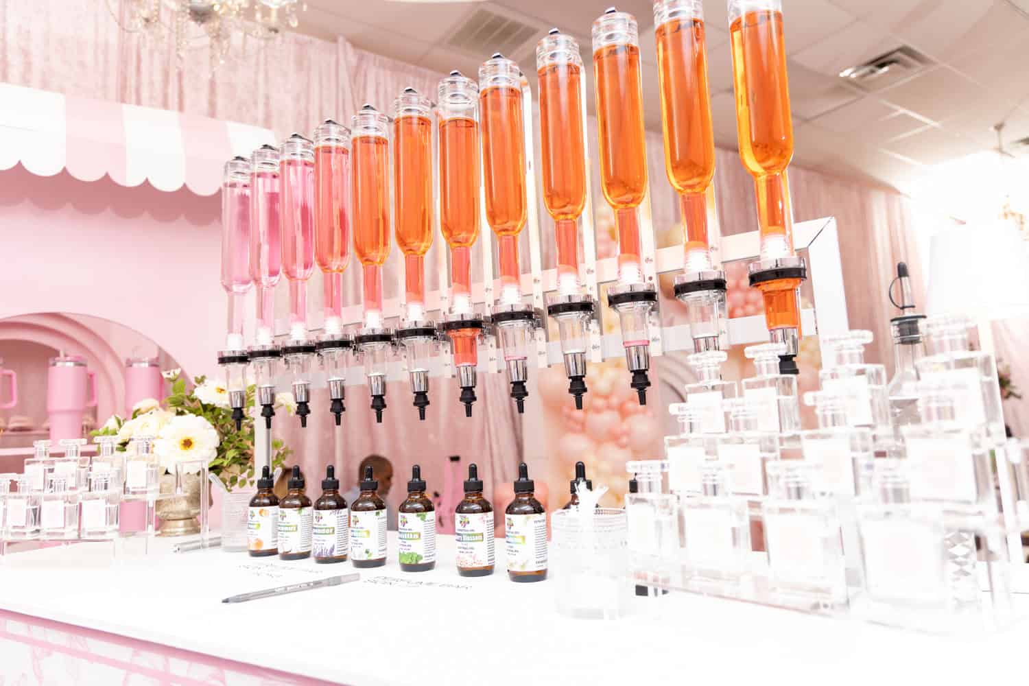 Beauty laboratory setup with colorful serum bottles and skincare products.