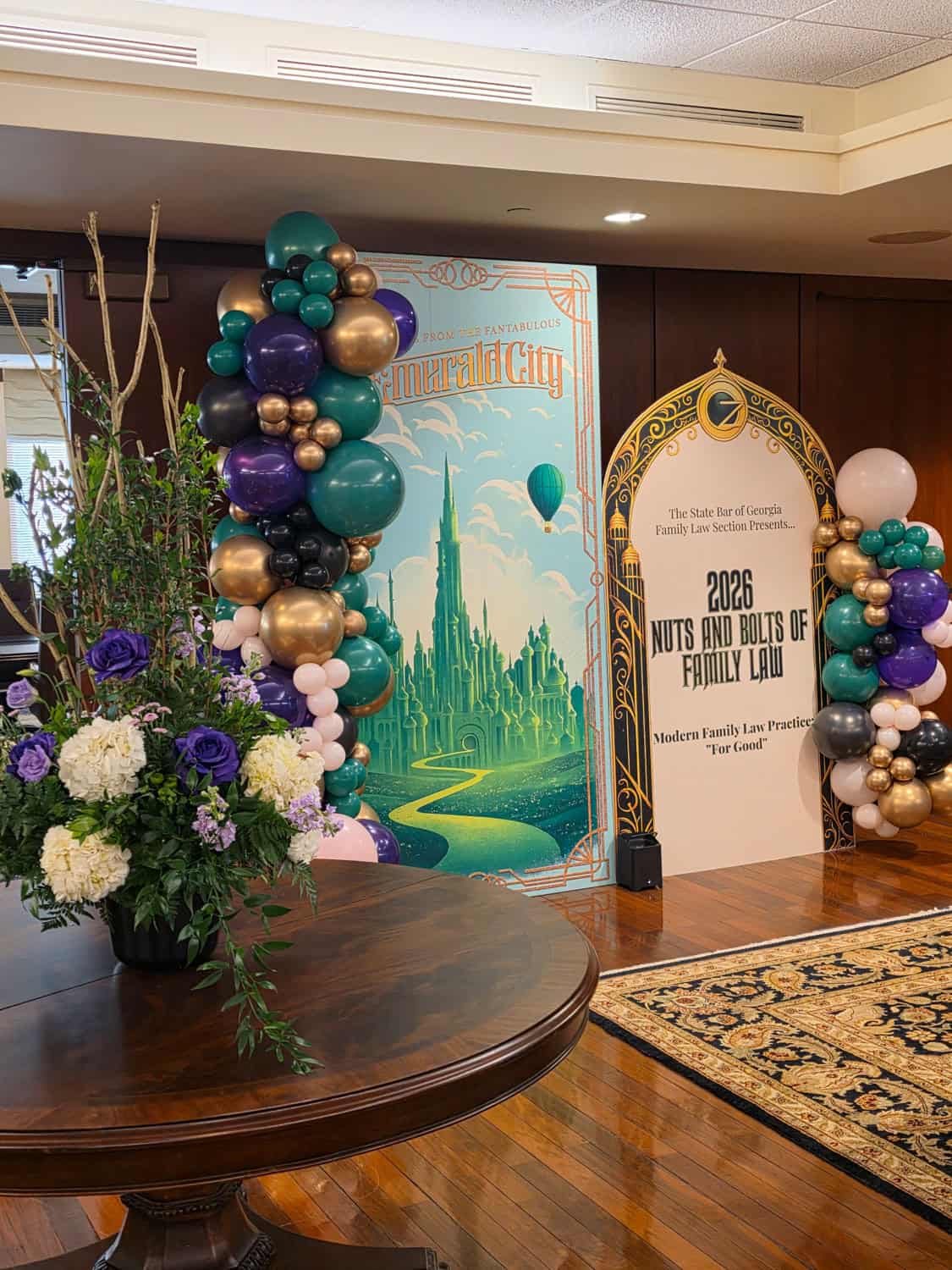 Decorative balloon arrangements and banner for family law event at Angela J. White Consulting.