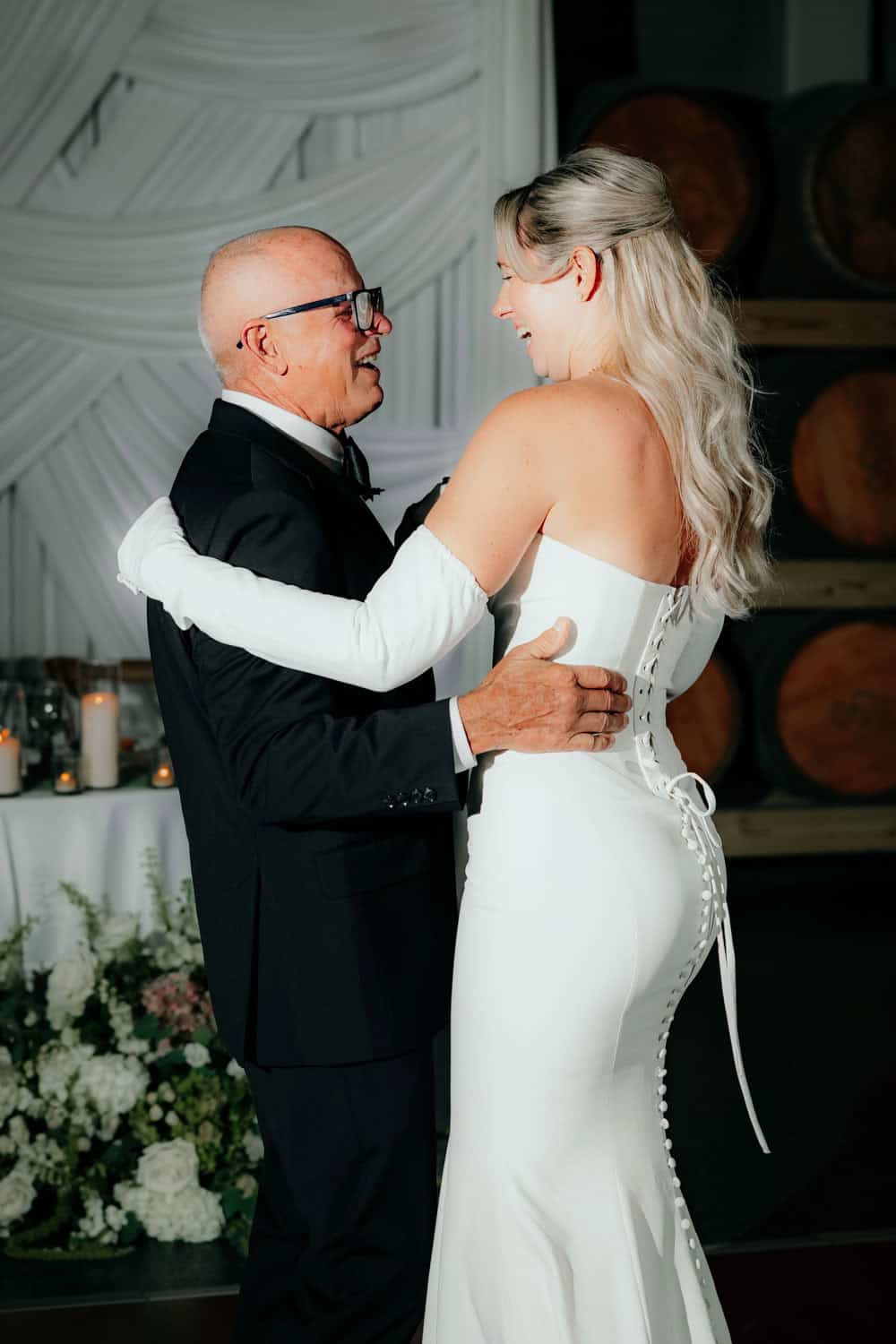 Bride and father dancing at wedding reception.
