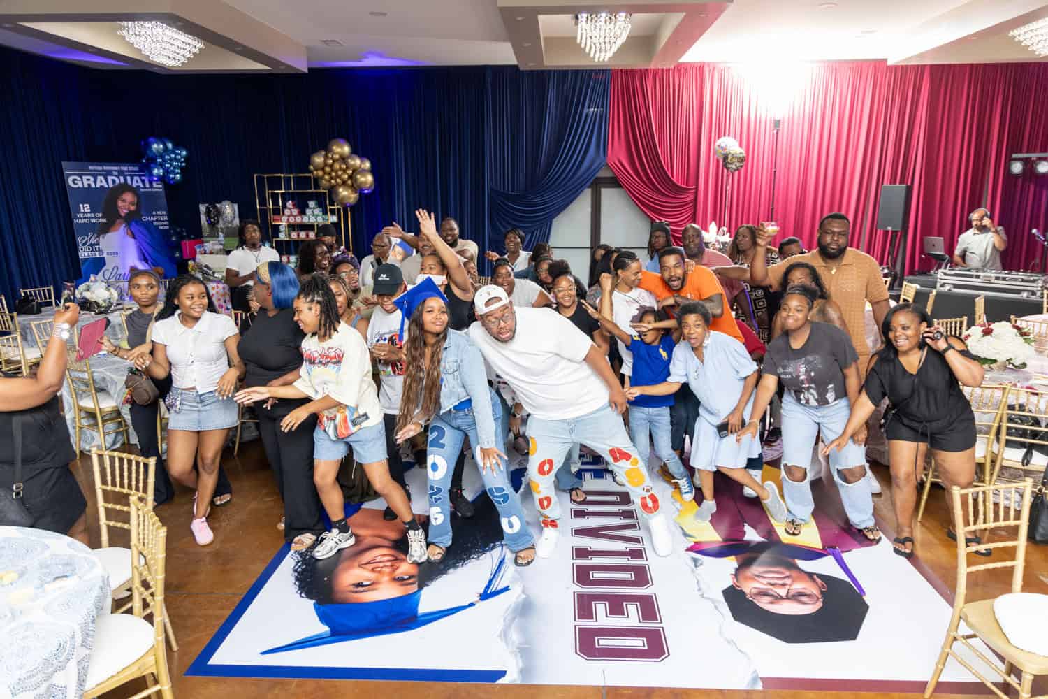 Group of people celebrating at Angela J. White Consulting event with dance and fun.