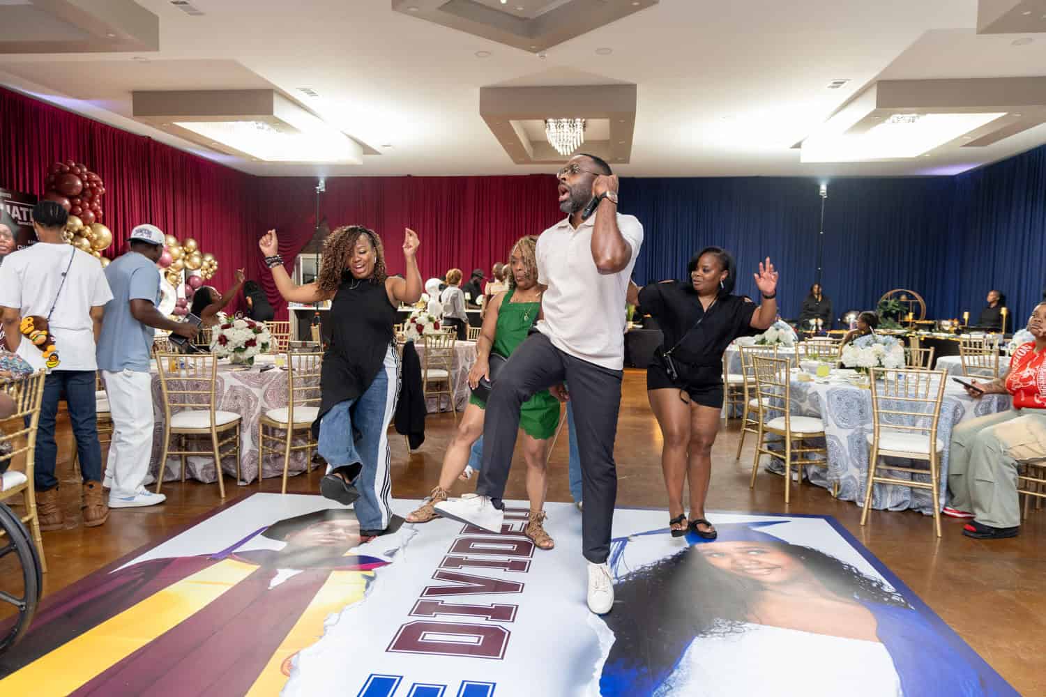 People dancing and celebrating at a corporate event or party.