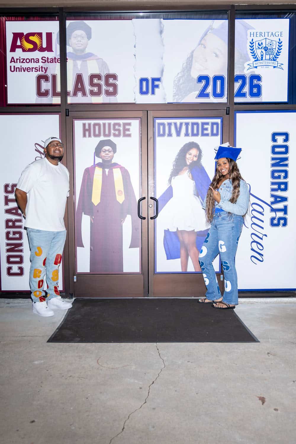 Two graduates celebrating graduation at Arizona State University.