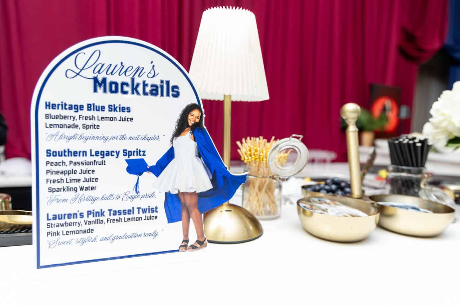 Event setup with mocktail menu and decorative table elements.