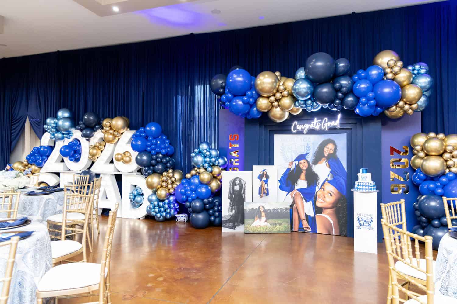 Graduation party decor with balloons and photo display by Angela J. White.