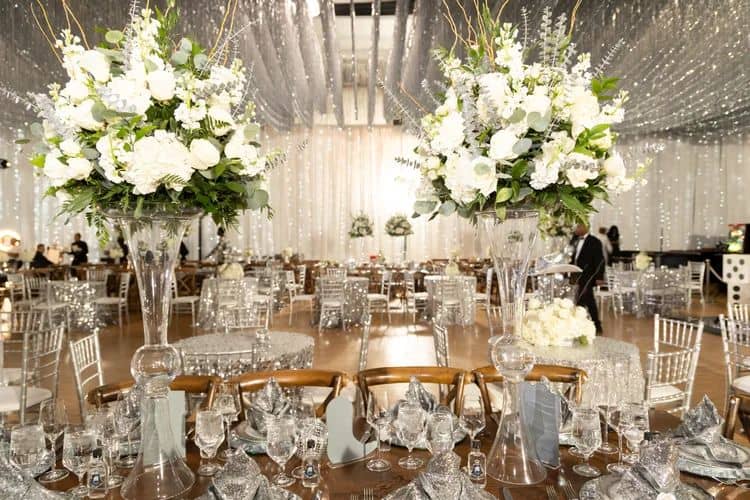 Beautiful wedding reception with floral centerpieces and elegant table settings.